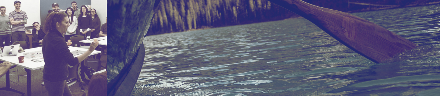 Heather Corallo talking to a group of people. Canoe paddle dipping into water.